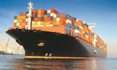 orange black loaded container ship harbour 1.jpg