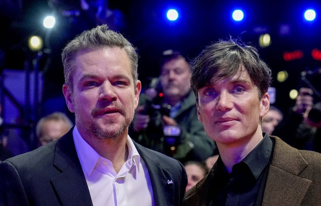 Actor Cilian Murphy right and producer Matt Damon stand on the red carpet outside the Berlinale Pala.jpeg