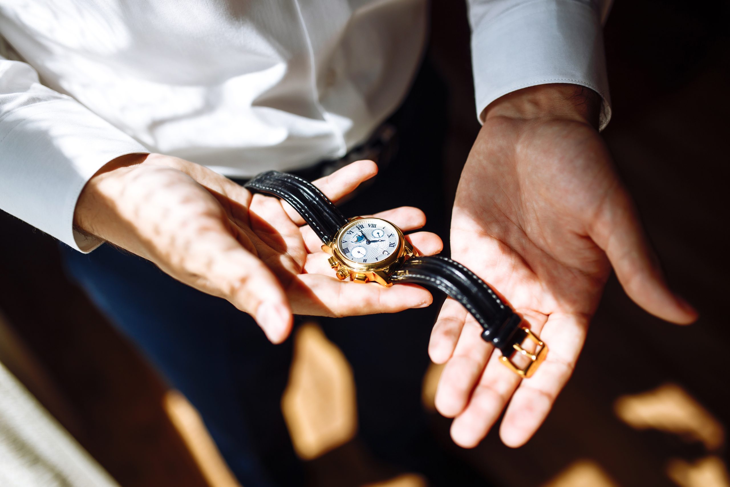 Stylish men's wrist watch, the man is watching the time. . Businessman checking time on his wristwatch.